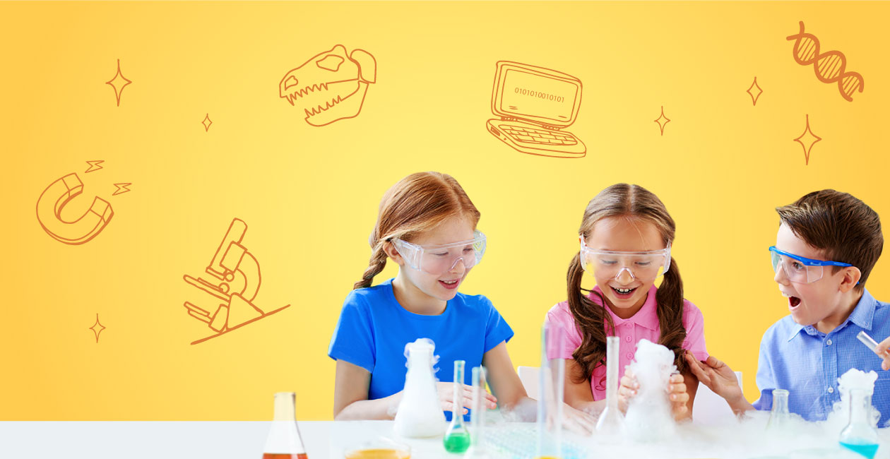 3 kids wearing protective goggles using flasks and test tubes