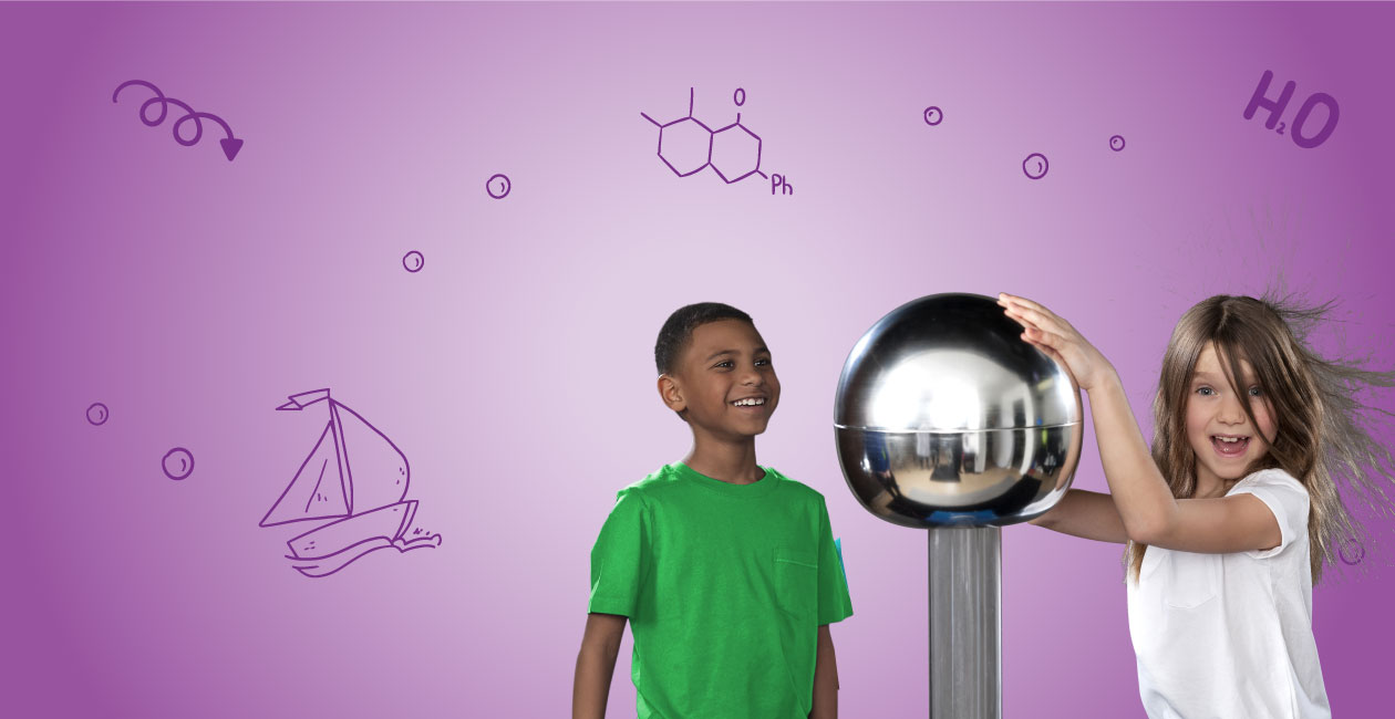 A boy looking at a girl touching an electro ball causing her hair to stand in the air